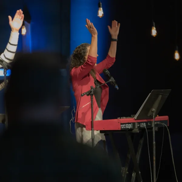 Worship keyboard player clapping hands Worship keyboard player clapping hands